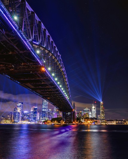 Sydney Harbour Bridge illuminated against the night sky in Australia
