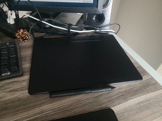 A drawing tablet placed on a table.