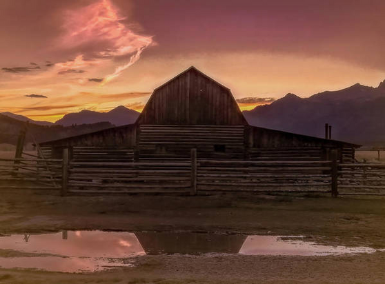 Teton Moulton Barn Sunset reflected in a puddle here:

https://pixels.com/featured/teton-moulton-barn-sunset-norma-brandsberg.html