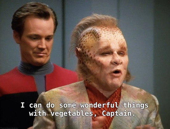 Voyager scene.
Neelix iand Tom Paris are standing. Neelix in front in some cabana host outfit and Tom Paris is *right* behind him in normal uniform. Neelix speaking and looks excited, like he's trying to taste the air. Paris, just behind, is looking down behind Neelix with yearning eyes and distraction. Closed caption reads, "I can do some wonderful things with vegetables, Captain."