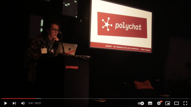 screenshot of the presentation video on youtube showing the speaker in front of the presentation screens