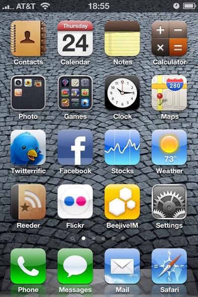 Home screen of an iPhone with various app icons such as Contacts, Calendar, Notes, Calculator, Twitterrific, and Facebook.