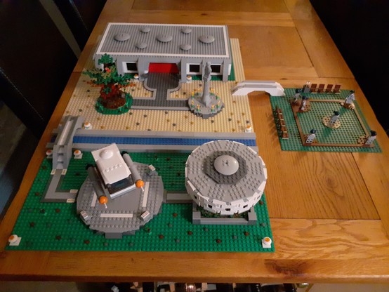 An overhead shot of my Pike City, Cestus III Diorama, featuring a Diplomatic Headquarters, Shuttle Pad, Communications Tower, #ZeframCochrane Monument and the #PikeCityPioneers Training Field
