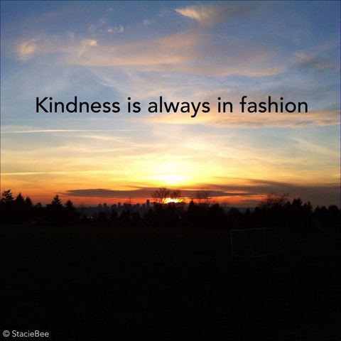 Square photo of peaceful sunset with black text added on the top over the sky: Kindness is always in fashion

Wispy clouds in a blue sky above the sun setting above the horizon. Yellow and orange colours getting darker as the sun sinks down. I was looking south towards Vancouver from Ray Perrault Park in North Vancouver. Below the sun in the center are black silhouettes of trees in front of black silhouettes of buildings forming the skyline in downtown Vancouver. The bottom third of the photo is completely black.