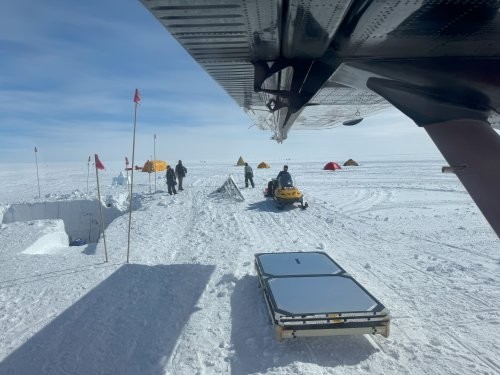 General view of the payload landing site. The roof-like structure is the left wing of the Twin Otter plane that transported the rescue team. 