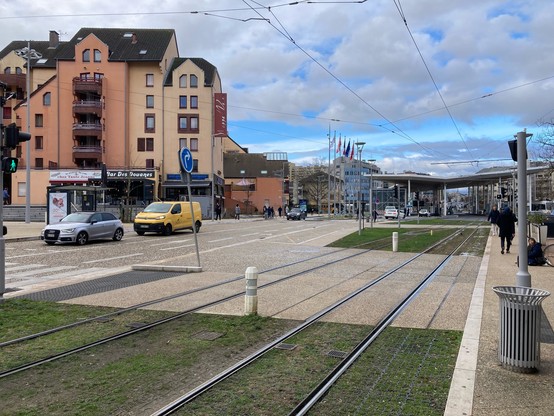 The same location as the previous photo, in which the road has been hugely broadened with new tram lines separated from the road traffic