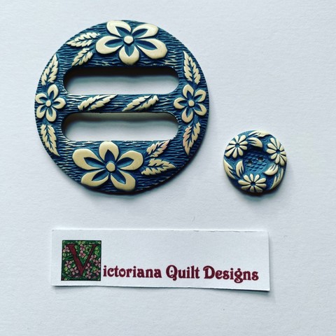 Blue & white belt buckle & button. 