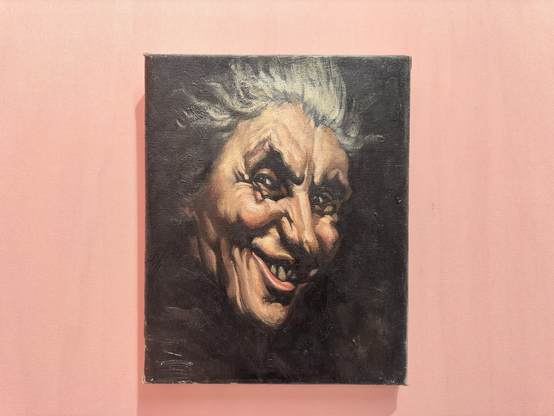 A small painting depicting an older woman, with a fiendish grin on her face. The white woman has white greyish hair and looks directly at the viewer. The background is black. The work was made by Rotterdam artist Agnes Canta. 