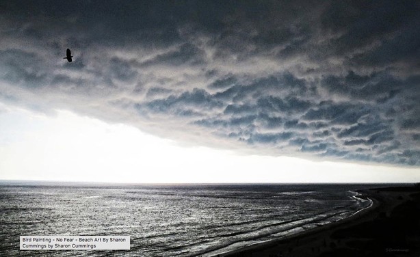 Sea hawk soaring into storm clouds over the ocean by artist and poet Sharon Cummings.   Haiku in post.