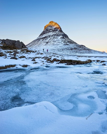 Iceland's Kirkjufell mountain bathed in the hues of winter sunset