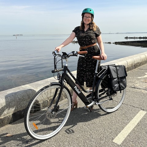 Katherine with her e-bike on a separated bike path by Port Phillip Bay