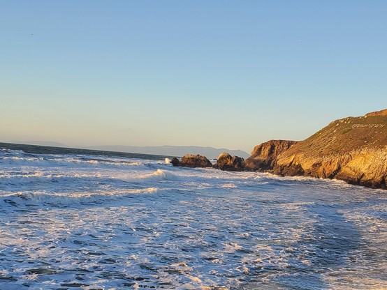 More gorgeous waves with blue sky above.