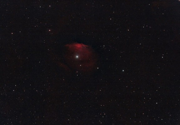 vdB38:
Background is black with stars throughout, including a few brighter ones.
At center is a particularly bright star surrounded by some red nebulosity in a somewhat circular shape.