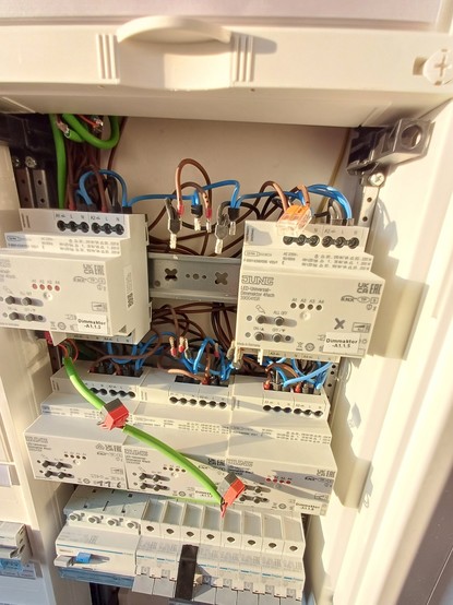 Subdistribution board with removed actuator and loose wires.