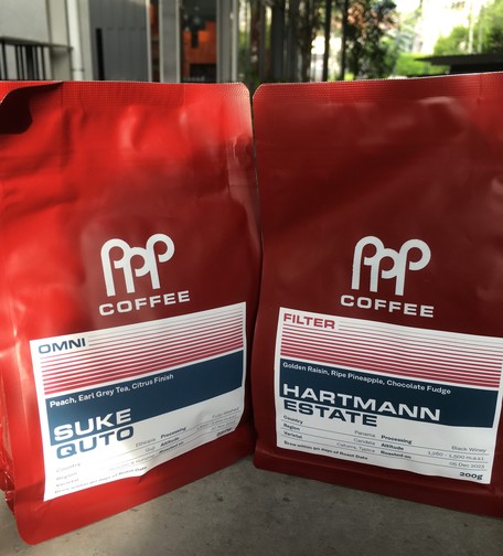 Two Papa Palheta (PPP) Coffee bags on a table. They look like normal air-filled coffee bags. On the left is Suke Quto. On the right is the Hartmann estate bag seen later.