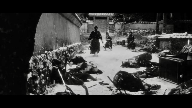 In a snowy alley, a samurai makes his way through the enemies. Many of them are already lying on the ground, but two are still standing in his way.
