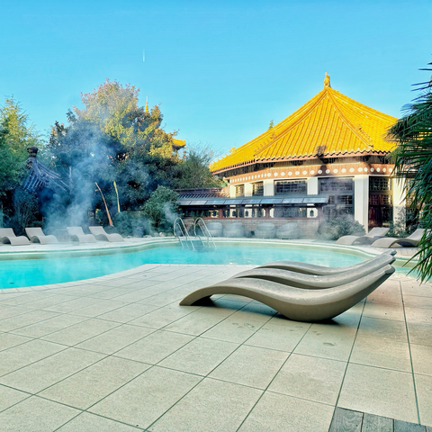 Photo of Ling Bao outdoor pool. Steam rises from the empty pool. 