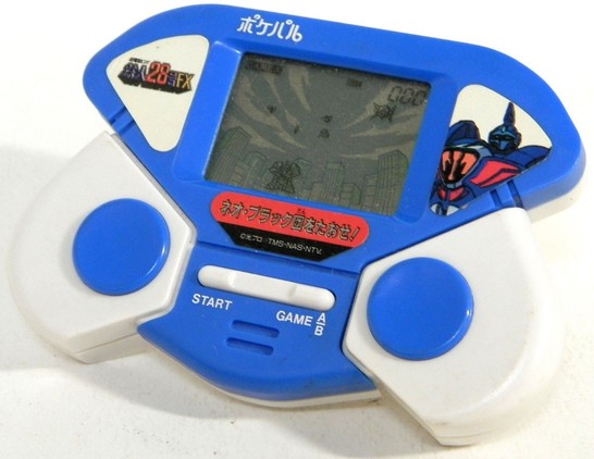 a handheld video game from the early 1990s, giant robot-themed, it is blue and white plastic colored, an illustration of the robot on the right side, the logo of the robot on the left, there are two large circular buttons, and one long horizontal button in the center that says 'start' on the left and 'game a/b' on the right 