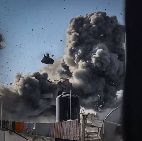 4: A huge cloud of smoke with rubble flying through the air. 

The clothesline, satellite receiver, and water tank are in the foreground of all the photos and appear undamaged.