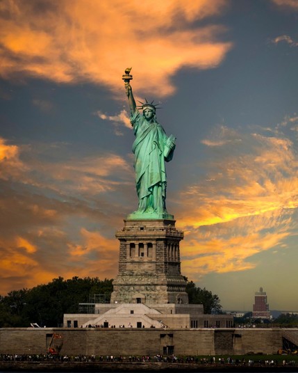 Sunsetting over The Statue Of Liberty, New York City, USA