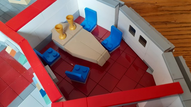 The #TOS Conference Room, with the iconic blue chairs and diamond shaped table