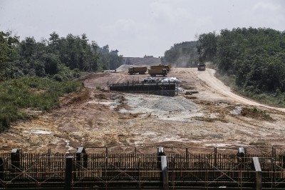 Several lorries at the construction site of the East Coast Rail Link project. / Photo from linked article.