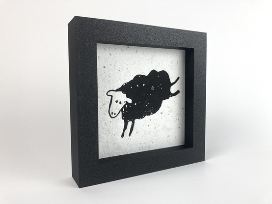 A framed relief print of the sheep from the Minor Threat "Out of Step" album.