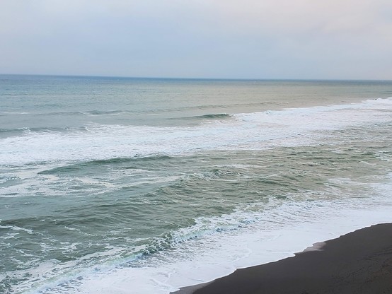 The waves were quite soothing; not a lot of splashiness or chop.  The contrast wuth the almost-black sand of the beach is always striking.