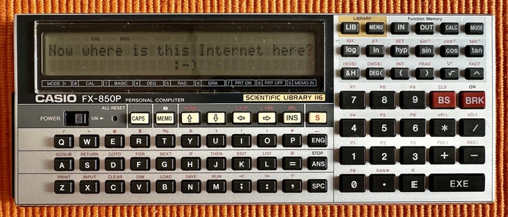 Casio FX-850P personal computer calculator with qwerty keyboard and the text "Now where is this Internet here? :-)" displayed on the screen.