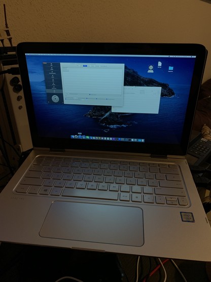 An HP notebook running macOS.