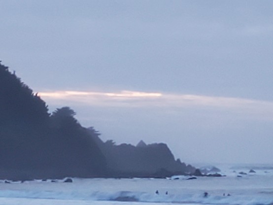 Just the beginning of dusk; lots of ambient light and a whitish pale-blue sky.