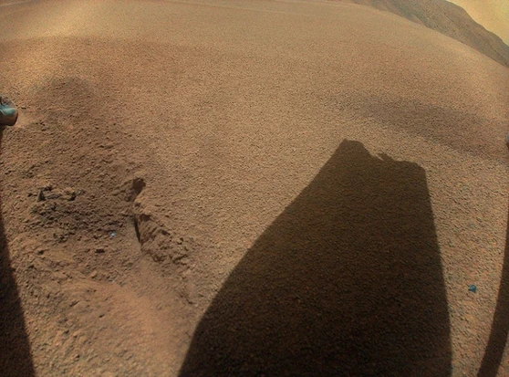 After Ingenuity’s last flight, it took this picture looking down at the Mars soil. The shadow of its damaged blade is visible.
Credit: NASA/JPL-Caltech