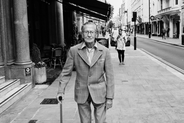 Photo of older gentleman on Jermyn Street in London. Taken with Fuji X-Pro 2.