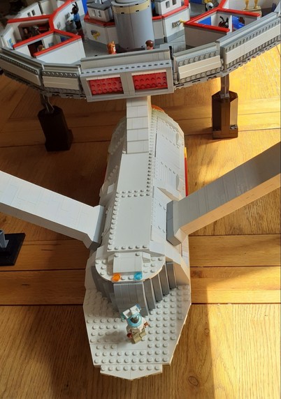 A closer look at the #Shuttlebay Doors (with a #Starfleet minifigure in an #EVSuit for scale) and the #ImpulseEngines at the rear of the #PrimaryHull