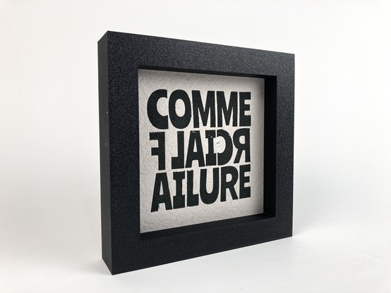 A framed relief print that says "Commercial Failure".