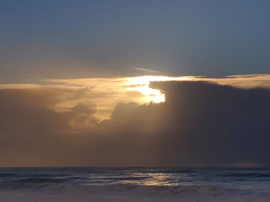 Old Sol turns orange, determined to glow in spite of the cloud dragons' best efforts.