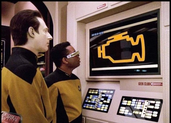 Picture of Data and LaForge staring at a monitor aboard the "Enterprise"... The monitor shows a "check engine" symbol.