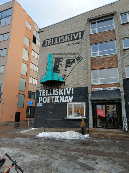 A green hand on the wall of the building in Telliskivi. A middle finger is up. 