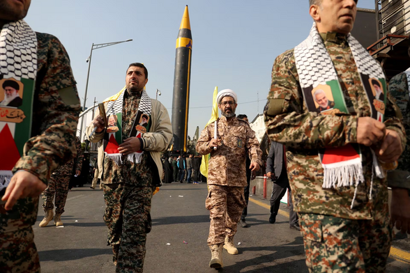 A cleric member of Basij paramilitary forces attends a rally in support of Palestinians, in Tehran, Iran, November 24, 2023