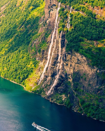 Sunnylvsfjorden fjord and Seven Sisters waterfalls, near Geiranger village in Norway