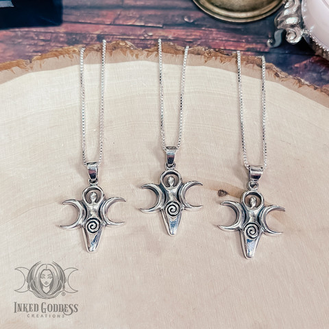 A photo of the "Triple Moon Spiral Goddess Sterling Silver Necklace" product from IGC.