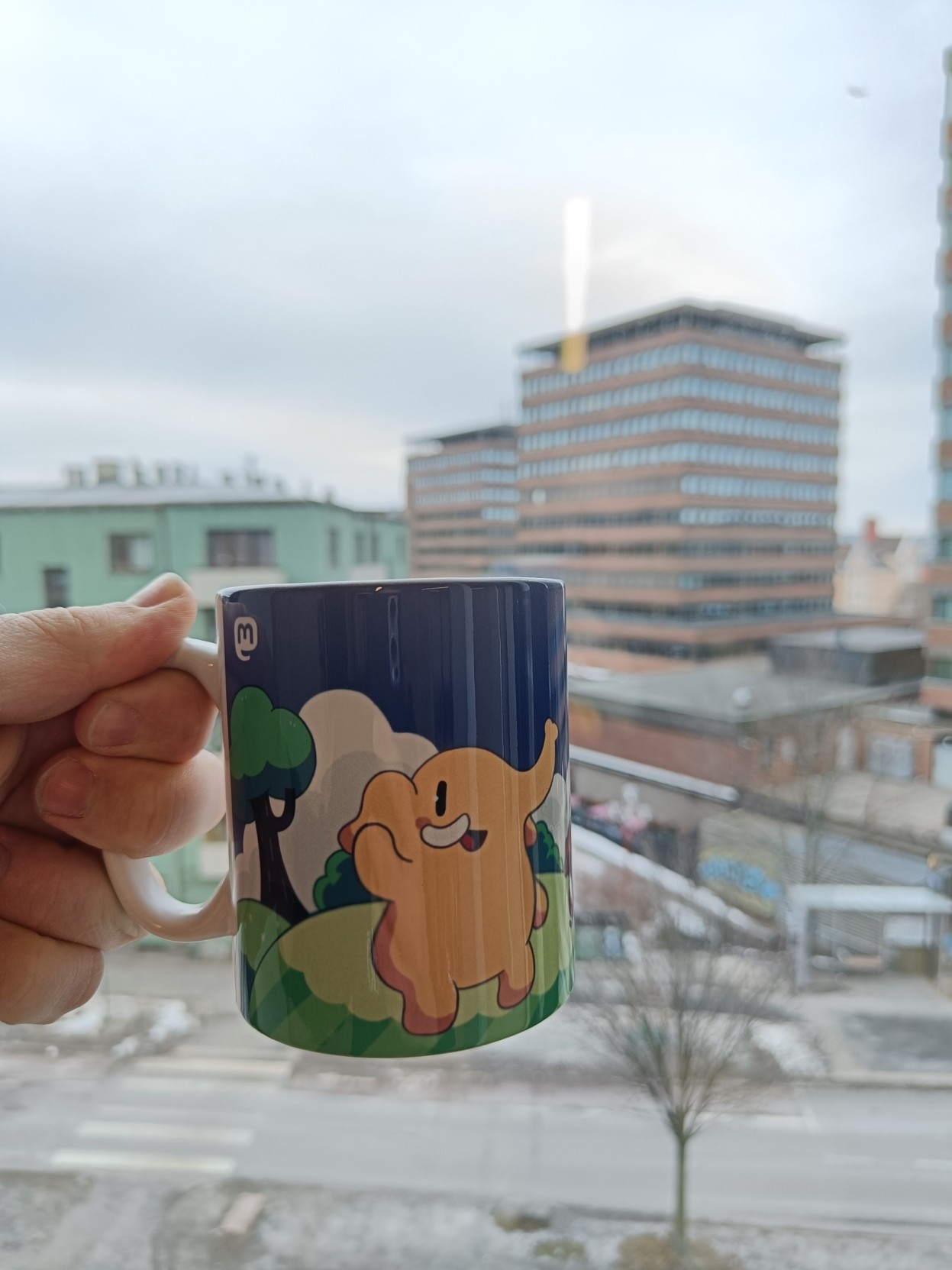 Mastodon mug with Tøyen, Oslo in the background