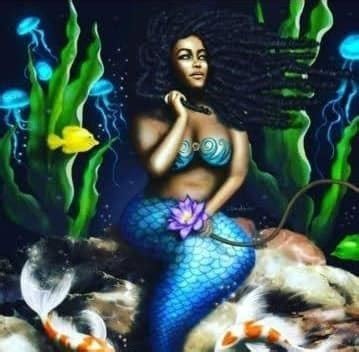 Anansa as a black mermaid with a blue fishtail and long, thick braided hair flowing in the underwater current. Fish and jellyfish surround her and she holds what looks like a lotus flower in her hand.