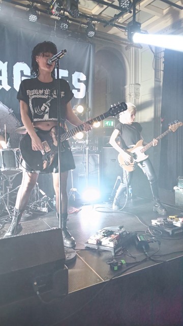 Photo of the band Saint Agnes on stage.