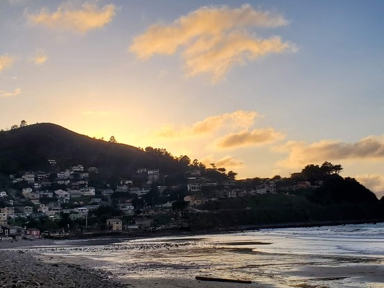 Old Sol was hiding out behind the rocks today, but the orange dusk-glow was still there.  I love the way it highlights the village just before sunset.