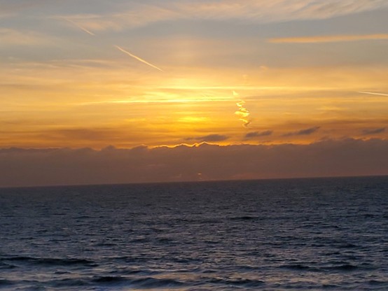 The big ball of plasma taunting the cloud dragons on the horizon.  The game of Hide the Shiny Thing is on!
