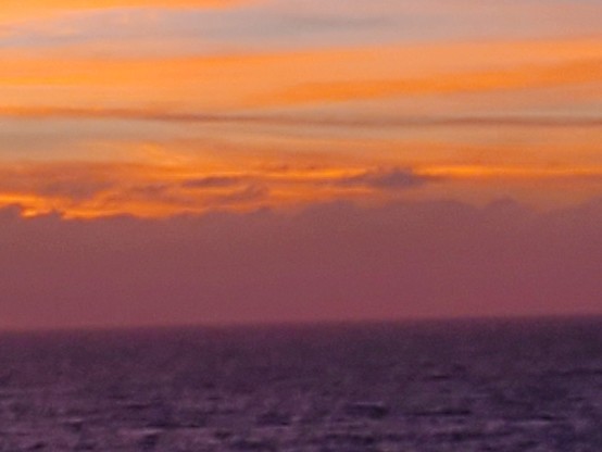 The orange makes a lovely contrast with the dark blue waves below.