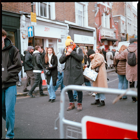 Photo of a man lighting a cigarette.