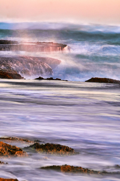 Layers of sea shelves covered with wave motions onto the rocks in Pirate Bay Mornington Australia