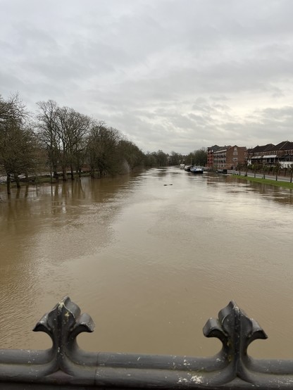 The river Ouse viewed from a bridge - the banks have overrun 